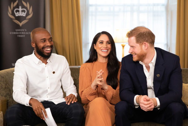 Duke and Duchess of Sussex on a sofa for the Queens Commonwealth Trust event